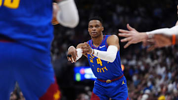 May 3, 2025; Denver, Colorado, USA; Denver Nuggets guard Russell Westbrook (4) passes in the third quarter against the LA Clippers during game seven of first round for the 2025 NBA Playoffs at Ball Arena. Mandatory Credit: Ron Chenoy-Imagn Images