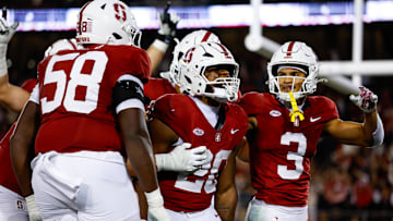 Nov 22, 2025; Stanford, California, USA; Stanford Cardinal running back Micah Ford (20) celebrates with teammates after scoring a touchdown during the fourth quarter against the California Golden Bears at Stanford Stadium. Mandatory Credit: Sergio Estrada-Imagn Images