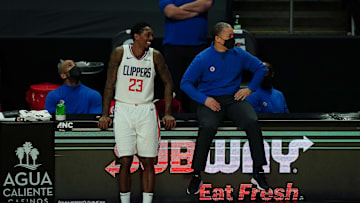 Feb 15, 2021; Los Angeles, California, USA; LA Clippers coach Tyronn Lue and guard Lou Williams (23) react in the final minute of the game against the Miami Heat at Staples Center. The Clippers defeated the Heat 125-118. Mandatory Credit: Kirby Lee-Imagn Images