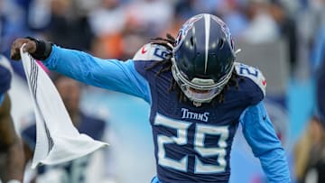 Jarvis Brownlee Jr. hits the field before the Titans play the Bengals.