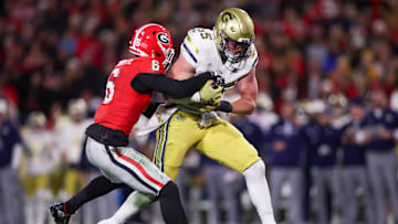 Nov 29, 2024; Athens, Georgia, USA; Georgia Bulldogs defensive back Daylen Everette (6) tackles Georgia Tech Yellow Jackets tight end Jackson Hawes (85) in the second quarter