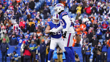 Jan 12, 2025; Orchard Park, New York, USA; Buffalo Bills linebacker Matt Milano (58) and defensive end Greg Rousseau (50) celebrate a sack during the fourth quarter against the Denver Broncos in an AFC wild card game at Highmark Stadium.