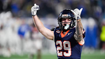 Dec 6, 2025; Charlotte, NC, USA; Virginia Cavaliers running back Davis Lane Jr. (29) celebrates going into overtime against the Duke Blue Devils during the 2025 ACC Championship game at Bank of America Stadium. Mandatory Credit: Jim Dedmon-Imagn Images