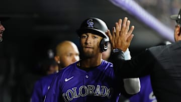 Jun 24, 2025; Denver, Colorado, USA; Colorado Rockies shortstop Ryan Ritter (8) celebrates scoring a run in the eighth inning inning against the Los Angeles Dodgers at Coors Field. Mandatory Credit: Ron Chenoy-Imagn Images
