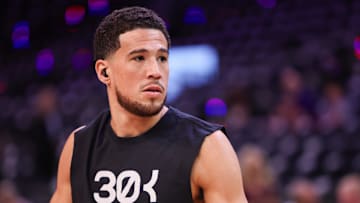 Feb 27, 2025; Phoenix, Arizona, USA; Phoenix Suns guard Devin Booker (1) warms up before a game against the New Orleans Pelicans at Footprint Center. Mandatory Credit: Brett Davis-Imagn Images
