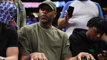 Apr 27, 2024; Orlando, Florida, USA; Orlando Magic former guard Tracy McGrady looks on from the sidelines during a game against the Cleveland Cavaliers in the fourth quarter during game four of the first round for the 2024 NBA playoffs at Kia Center. Mandatory Credit: Nathan Ray Seebeck-Imagn Images