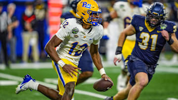 Pittsburgh Panthers quarterback Julian Dugger (12) escapes the pocket and runs during the second half of the 2024 GameAbove Sports Bowl at Ford Field in Detroit, on Thursday, Dec. 26, 2024.
