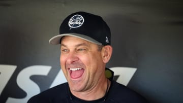 Jun 1, 2024; San Francisco, California, USA; New York Yankees manager Aaron Boone (17) laughs while talking to the media in the dugout before the game between the San Francisco Giants and the New York Yankees at Oracle Park. Mandatory Credit: Robert Edwards-USA TODAY Sports
