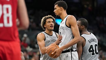 Nov 7, 2025; San Antonio, Texas, USA; San Antonio Spurs forward Jeremy Sochan (10) talks to forward Victor Wembanyama (1) during the second half at Frost Bank Center.