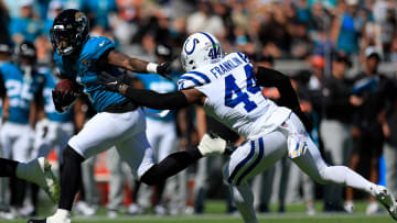 Jacksonville Jaguars running back Travis Etienne Jr. (1) escapes Indianapolis Colts linebacker Zaire Franklin (44) during the second quarter of an NFL football matchup Sunday, Oct. 15, 2023 at EverBank Stadium in Jacksonville, Fla. The Jacksonville Jaguars defeated the Indianapolis Colts 37-20. [Corey Perrine/Florida Times-Union]