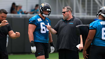 Jacksonville Jaguars guard Wyatt Milum (64) listens to offensive line coach Shaun Sarrett during a rookie minicamp at Miller Electric Center Saturday, May 10, 2025 in Jacksonville, Fla. [Corey Perrine/Florida Times-Union]