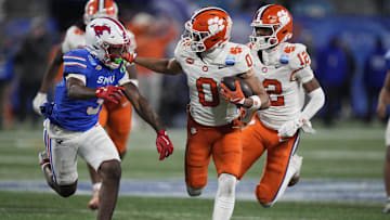 Dec 7, 2024; Charlotte, NC, USA; Clemson Tigers wide receiver Antonio Williams (0) runs against Southern Methodist Mustangs safety Ahmaad Moses (3) during the third quarter in the 2024 ACC Championship game at Bank of America Stadium. Mandatory Credit: Jim Dedmon-Imagn Images