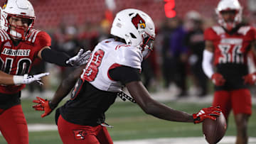 Louisville’s Jaleel Skinner catches the ball and scores a touchdown on Friday night at L&N Stadium