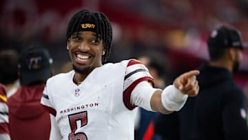 Sep 29, 2024; Glendale, Arizona, USA; Washington Commanders quarterback Jayden Daniels (5) celebrates.