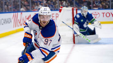 Oct 4, 2024; Vancouver, British Columbia, CAN; Edmonton Oilers forward Connor McDavid (97) handles the puck against the Vancouver Canucks during the second period at Rogers Arena. 