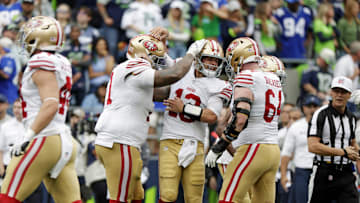 San Francisco 49ers quarterback Brock Purdy celebrates after throwing a touchdown pass against the Seattle Seahawks 