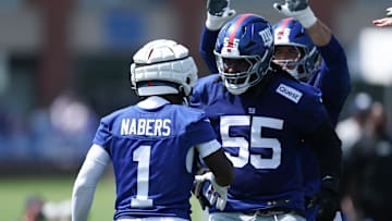 New York Giants wide receiver Malik Nabers celebrates with offensive tackle James Hudson III during training camp at Quest Diagnostics Training Center. 