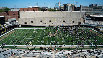 Vanderbilt fans and family gather on the field after the Vanderbilt Football Black and Gold Spring Game at FirstBank Stadium in Nashville, Tenn., Saturday, April 12, 2025.