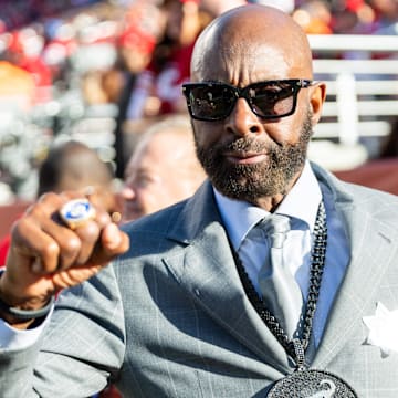 Dec 8, 2024; Santa Clara, California, USA; San Francisco 49ers legend Jerry Rice is excited for the game during the second quarter against the Chicago Bears at Levi's Stadium. Mandatory Credit: Bob Kupbens-Imagn Images