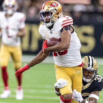 Sep 14, 2025; New Orleans, Louisiana, USA;  San Francisco 49ers wide receiver Jauan Jennings (15) runs after a catch against New Orleans Saints safety Jonas Sanker (33) during the first half at Caesars Superdome. Mandatory Credit: Stephen Lew-Imagn Images