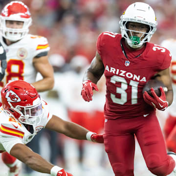 Aug 9, 2025; Glendale, Arizona, USA; Arizona Cardinals running back Emari Demercado (31) runs for a touchdown against the Kansas City Chiefs during a preseason NFL game at State Farm Stadium. Mandatory Credit: Mark J. Rebilas-Imagn Images