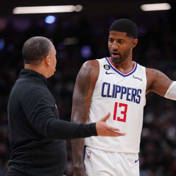 Los Angeles Clippers forward Paul George (13) talks with head coach Tyronn Lue during a break in the action against the Sacramento Kings in the third quarter at the Golden 1 Center. 