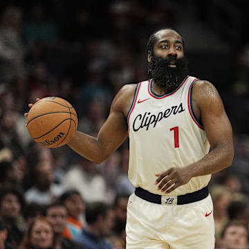 Jan 31, 2025; Charlotte, North Carolina, USA; LA Clippers guard James Harden (1) handles the ball against the Charlotte Hornets during the second half at Spectrum Center. Mandatory Credit: Jim Dedmon-Imagn Images