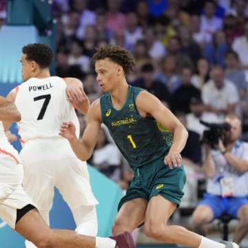 Jul 30, 2024; Villeneuve-d'Ascq, France; Canada guard Jamal Murray (4) moves the ball around Australia centre Jock Landale (13) and Australia point guard Dyson Daniels (1) in a men's group stage basketball match during the Paris 2024 Olympic Summer Games at Stade Pierre-Mauroy. Mandatory Credit: John David Mercer-USA TODAY Sports