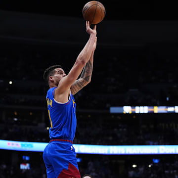 May 9, 2025; Denver, Colorado, USA; Denver Nuggets forward Michael Porter Jr. (1) shoots the ball in the fourth quarter against the Oklahoma City Thunder during game three of the second round for the 2025 NBA Playoffs at Ball Arena. Mandatory Credit: Ron Chenoy-Imagn Images