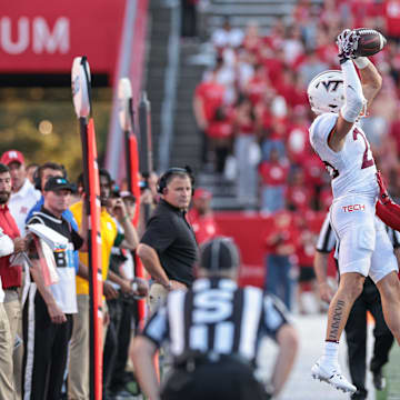 Sep 16, 2023; Piscataway, New Jersey, USA; Virginia Tech Hokies wide receiver Ayden Greene (26) is pushed out of bounds by Rutgers Scarlet Knights defensive back Max Melton (16) during the second half at SHI Stadium. Mandatory Credit: Vincent Carchietta-Imagn Images