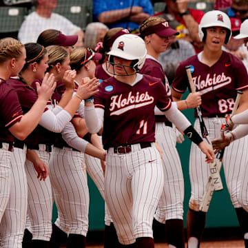 May 17, 2025; Tuscaloosa, AL, USA; Virginia Tech batter Kylie Aldridge is congratulated after hitting a home run at Rhoads Stadium. Alabama defeated Virginia Tech 4-3 to advance to the final.