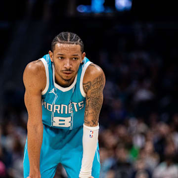 Mar 8, 2025; Charlotte, North Carolina, USA; Charlotte Hornets guard Nick Smith Jr. (8) takes a break during the fourth quarter against the Brooklyn Nets at Spectrum Center. Mandatory Credit: Scott Kinser-Imagn Images