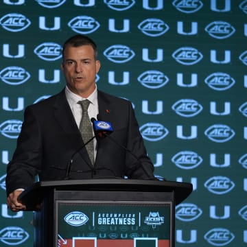 Jul 24, 2024; Charlotte, NC, USA;  Miami Hurricanes head coach Mario Cristobal speaks to the media during the ACC Kickoff at Hilton Charlotte Uptown. Mandatory Credit: Jim Dedmon-USA TODAY Sports