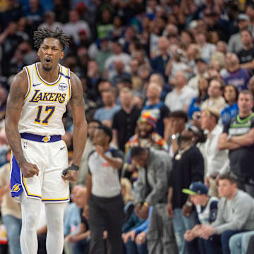 Apr 27, 2025; Minneapolis, Minnesota, USA; Los Angeles Lakers forward Dorian Finney-Smith (17) celebrates after scoring a three pointer agains the Minnesota Timberwolves in the fourth quarter during game four of first round for the 2025 NBA Playoffs at Target Center. Mandatory Credit: Matt Blewett-Imagn Images