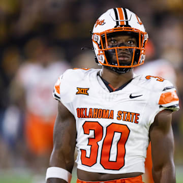 Sep 9, 2023; Tempe, Arizona, USA; Oklahoma State Cowboys linebacker Collin Oliver (30) against the Arizona State Sun Devils at Mountain America Stadium. Mandatory Credit: Mark J. Rebilas-Imagn Images