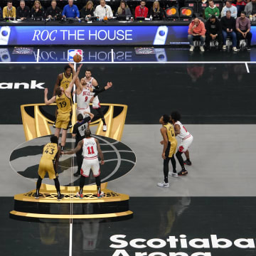 Nov 24, 2023; Toronto, Ontario, CAN; Toronto Raptors center Jakob Poeltl (19) and Chicago Bulls center Nikola Vucevic (9) on the tip-off during the first half on the In-Season Tournament floor at Scotiabank Arena. Mandatory Credit: John E. Sokolowski-USA TODAY Sports