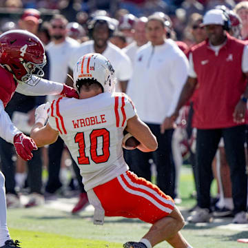 Nov 16, 2024; Tuscaloosa, AL, USA; Alabama Crimson Tide linebacker Qua Russaw (4) is called for a horse collar tackle on Mercer wide receiver Parker Wroble (10) at Bryant-Denny Stadium. Mandatory Credit: Gary Cosby Jr.-Tuscaloosa News