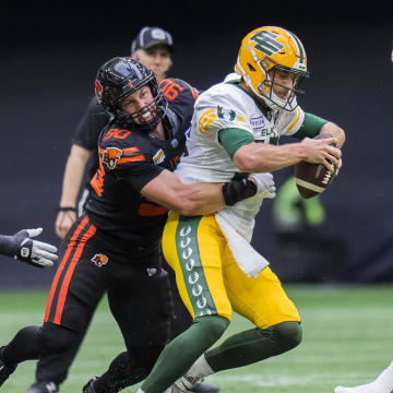 Jun 17, 2023; Vancouver, British Columbia, CAN; BC Lions defensive lineman Mathieu Betts (90) sacks Edmonton Elks quarterback Taylor Cornelius (15) in the second half at BC Place. BC won 22-0. Mandatory Credit: Bob Frid-USA TODAY Sports