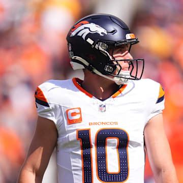 Sep 15, 2024; Denver, Colorado, USA; Denver Broncos quarterback Bo Nix (10) during the first quarter against the Pittsburgh Steelers at Empower Field at Mile High. Mandatory Credit: Ron Chenoy-Imagn Images