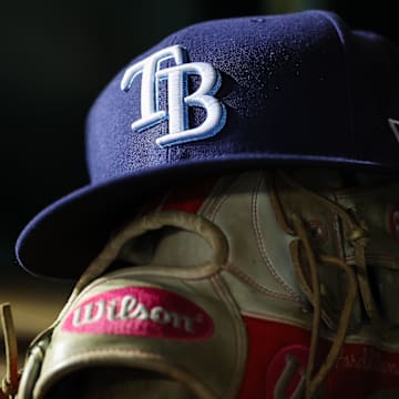 A general view of a Tampa Bay Rays hat and glove during the seventh inning of the game against the Washington Nationals at Nationals Park in 2023.