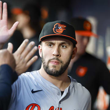 Baltimore Orioles starting pitcher Grayson Rodriguez (30) high-fives teammates in the dugout after being relieved for against the Seattle Mariners during the seventh inning at T-Mobile Park on July 2.