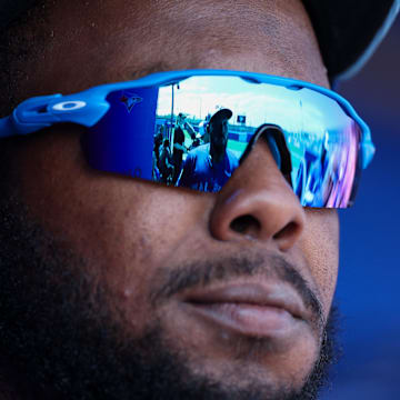 Toronto Blue Jays first baseman Vladimir Guerrero Jr. (27) talks to outfielder Anthony Santander (25) before a game against the Baltimore Orioles during spring training at TD Ballpark on March 13.
