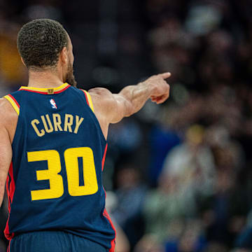 Mar 15, 2025; San Francisco, California, USA; Golden State Warriors guard Stephen Curry (30) celebrates after the basket against the New York Knicks during the fourth quarter at Chase Center. Mandatory Credit: Neville E. Guard-Imagn Images