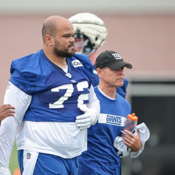 Jul 24, 2024; East Rutherford, NJ, USA; New York Giants guard Jermaine Eluemunor (72) walks off the field after an injury during training camp at Quest Diagnostics Training Facility.  