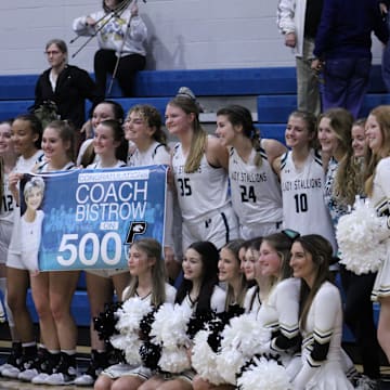 Providence girls basketball coach Gigi Bistrow and her team celebrate her 500th career victory after an FHSAA Region 1-3A girls basketball quarterfinal on February 10, 2022. [Clayton Freeman/Florida Times-Union]