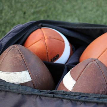 STOCK | Footballs rest in a bag at a high school football game between St. Augustine and Bolles in Jacksonville, Florida, on August 25, 2023. [Clayton Freeman/Florida Times-Union]