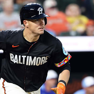 May 2, 2025; Baltimore, Maryland, USA; Baltimore Orioles first baseman Ryan Mountcastle (6) hits a single during the fifth inning against the Kansas City Royals at Oriole Park at Camden Yards. 