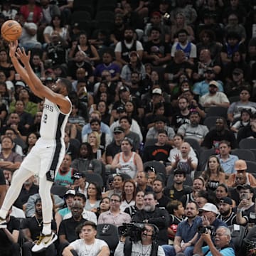 Oct 26, 2024; San Antonio, Texas, USA;  San Antonio Spurs guard Malaki Branham (22) shoots over Houston Rockets forward Dillon Brooks (9) in the first half at Frost Bank Center. Mandatory Credit: Daniel Dunn-Imagn Images