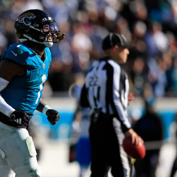 Jacksonville Jaguars running back Travis Etienne Jr. (1) runs to the sideline after scoring a touchdown during the third quarter of a regular season NFL football matchup Sunday, Dec. 31, 2023 at EverBank Stadium in Jacksonville, Fla. The Jacksonville Jaguars blanked the Carolina Panthers 26-0. [Corey Perrine/Florida Times-Union]