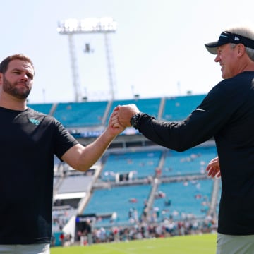 Jacksonville Jaguars head coach Doug Pederson, right, fist bumps offensive coordinator Press Taylor before an NFL football matchup Sunday, Sept. 24, 2023 at EverBank Stadium in Jacksonville, Fla. [Corey Perrine/Florida Times-Union]